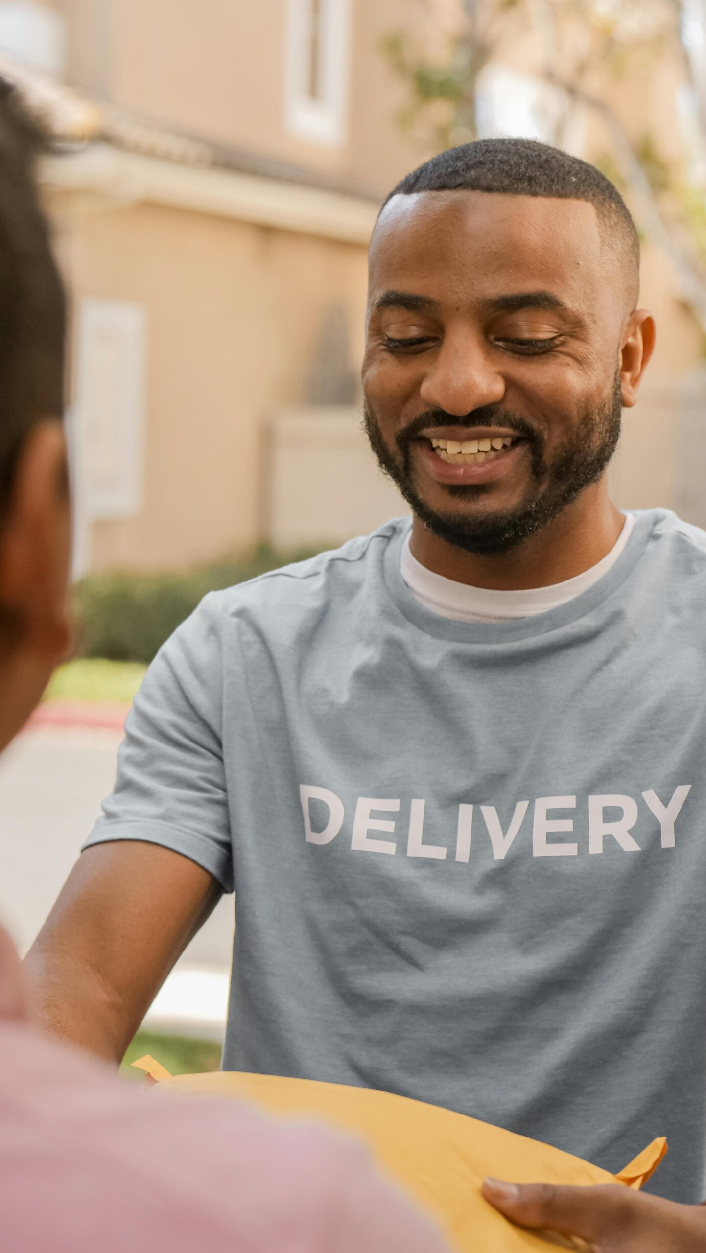 Photo of a Man Delivering a Parcel